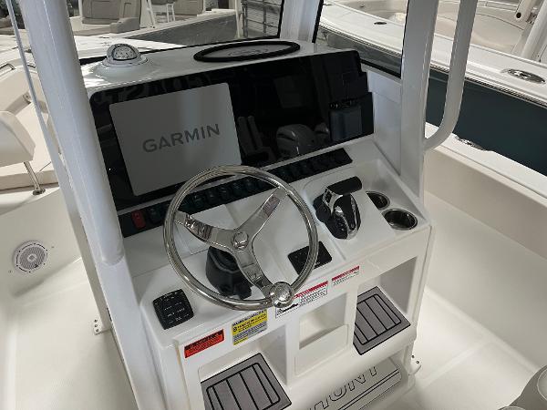 Slide: The Image of 2024 Sea Hunt Ultra 239 SE boat console with Garmin navigation system. - 10