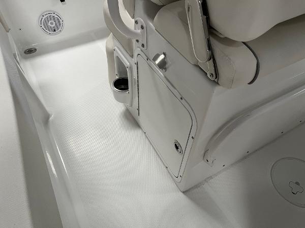 Slide: The Image of 2024 Sea Hunt Ultra 239 SE boat interior, featuring seating and storage compartments. - 14