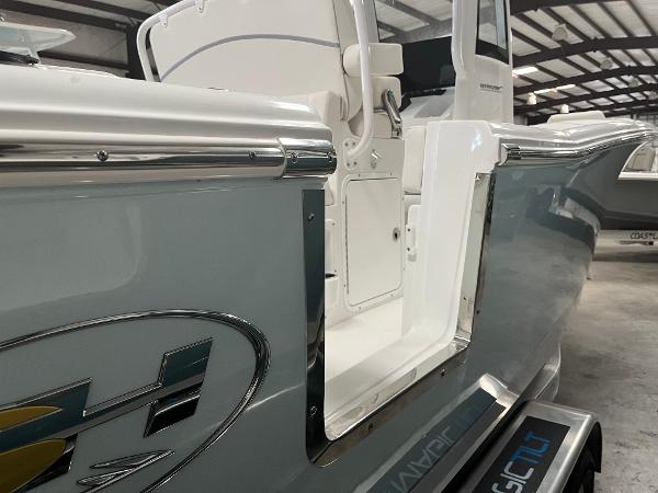 Slide: The Image of 2024 Sea Hunt Ultra 239 SE boat side view in a warehouse. - 22