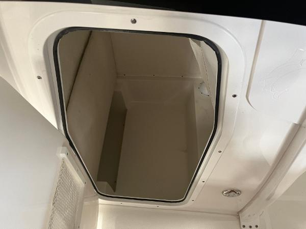 Slide: The Image of 2024 Sea Hunt Ultra 239 SE storage compartment. - 8