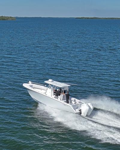 Slide: The Image of 2024 SeaHunter 31 boat cruising on open water. - 1