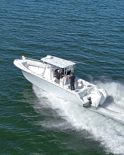 Slide: The Image of 2024 SeaHunter 31 boat cruising on open water. - 2
