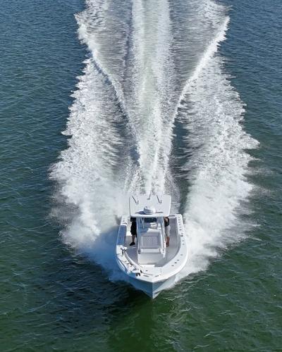 Slide: The Image of 2024 SeaHunter 31 boat cruising on open water. - 3