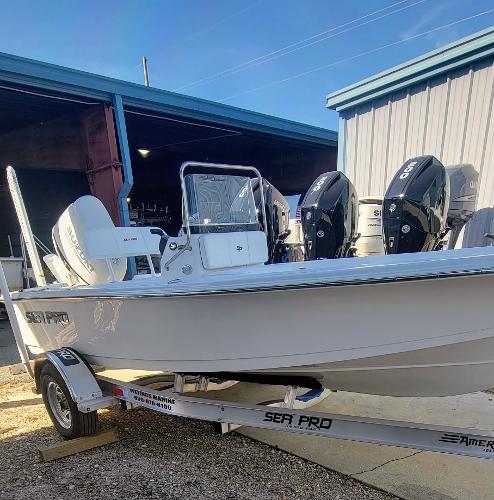 Slide: The Image of 2024 Sea Pro 172 Bay boat on trailer with dual outboard motors. - 0