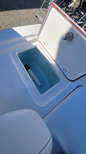 Slide: The Image of 2024 Sea Pro 172 Bay boat storage compartment with open lid. - 12