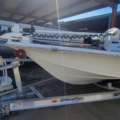 Slide: The Image of 2024 Sea Pro 172 Bay boat on trailer with Minn Kota trolling motor. - 2