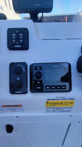 Slide: The Image of Control panel of a 2024 Sea Pro 172 Bay boat with capacity label. - 7