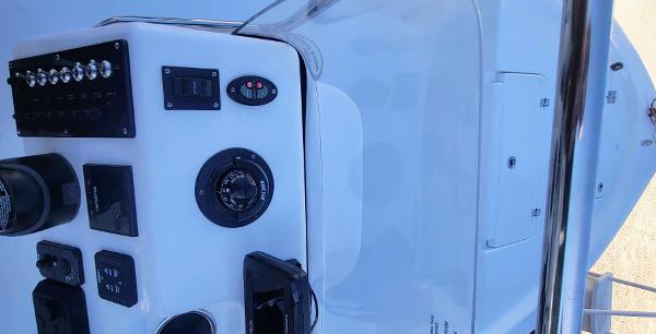 Slide: The Image of 2024 Sea Pro 172 Bay boat console with navigation and control instruments. - 9