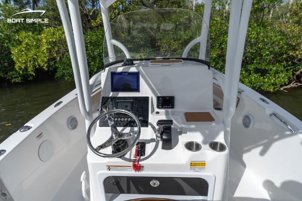 Slide: The Image of 2023 Sea Pro 219 Deep V CC boat console with steering wheel and navigation equipment. - 3