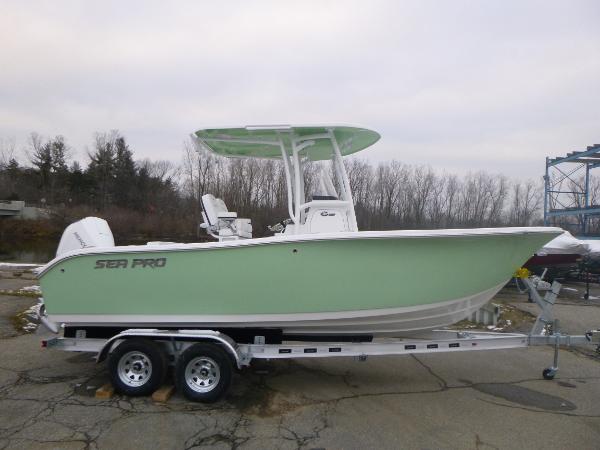 Slide: The Image of 2024 Sea Pro 222 Center Console boat on a trailer, side view. - 0