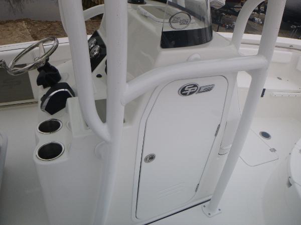 Slide: The Image of 2024 Sea Pro 222 Center Console boat interior with steering wheel and storage compartment. - 11