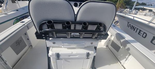 Slide: The Image of 2020 Sea Pro 239CC boat interior with rod holders and storage. - 15