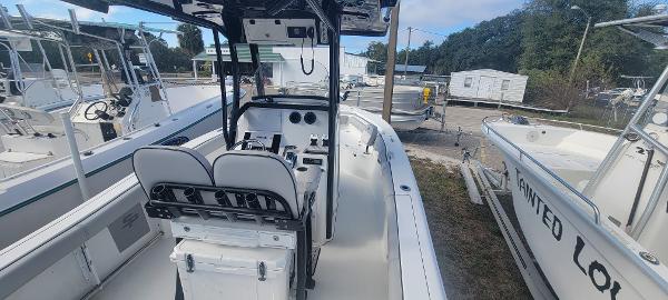 Slide: The Image of 2020 Sea Pro 239CC center console boat docked at a marina. - 16