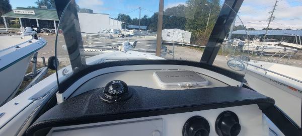 Slide: The Image of 2020 Sea Pro 239CC boat dashboard with compass and controls. - 17