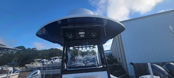 Slide: The Image of 2020 Sea Pro 239CC boat at a marina with other boats in the background. - 19