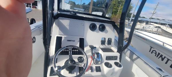 Slide: The Image of 2020 Sea Pro 239CC boat console with steering wheel and controls. - 22