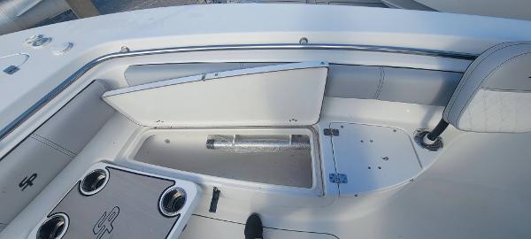 Slide: The Image of 2020 Sea Pro 239CC boat interior with open storage compartments. - 25