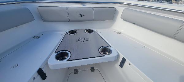Slide: The Image of 2020 Sea Pro 239CC boat interior with seating and table. - 26