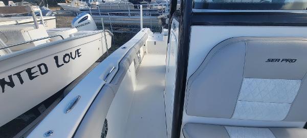 Slide: The Image of 2020 Sea Pro 239CC boat interior with white and beige seating. - 28