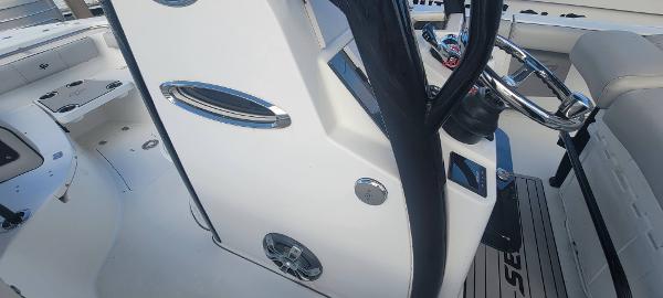 Slide: The Image of 2020 Sea Pro 239CC center console boat interior with steering wheel and seating. - 34