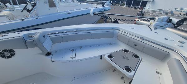 Slide: The Image of 2020 Sea Pro 239CC boat interior with cushioned seating and cup holders. - 36