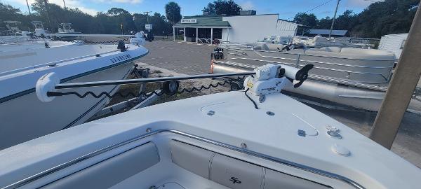 Slide: The Image of 2020 Sea Pro 239CC boat at a dealership, showcasing the bow and trolling motor. - 4