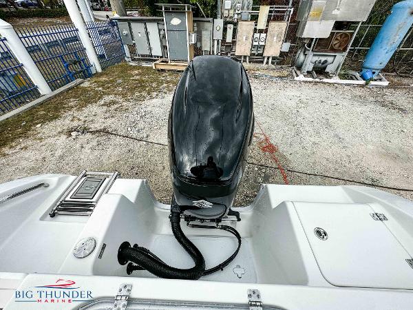 Slide: The Image of 2023 Sea Pro 239 DLX boat engine and stern view at Big Thunder Marine. - 11