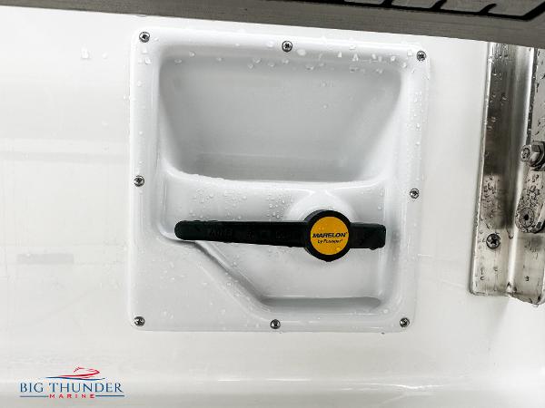 Slide: The Image of 2023 Sea Pro 239 DLX boat detail with water droplets and Big Thunder Marine logo. - 15