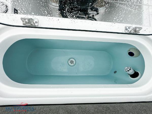 Slide: The Image of 2023 Sea Pro 239 DLX livewell with water and drainage system. - 18