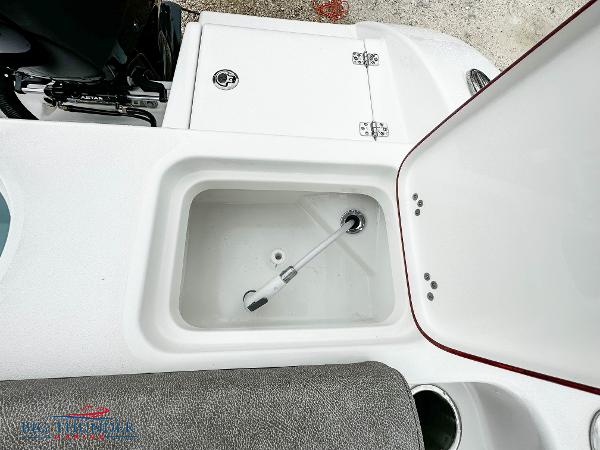 Slide: The Image of 2023 Sea Pro 239 DLX boat storage compartment and livewell. - 19
