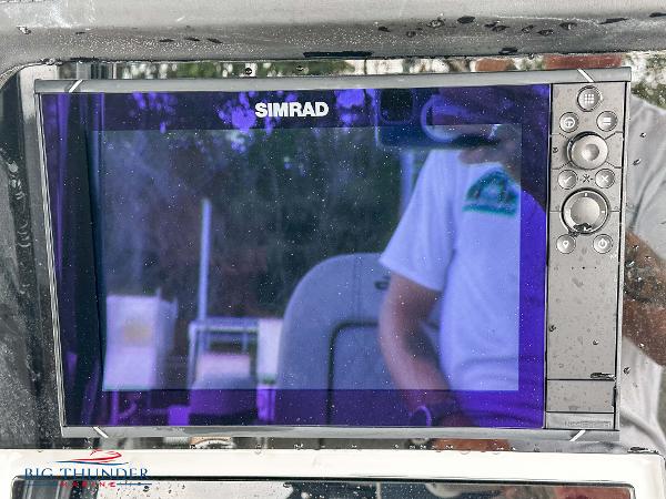 Slide: The Image of Simrad display on 2023 Sea Pro 239 DLX boat dashboard. - 28