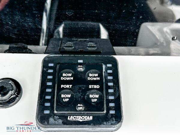 Slide: The Image of Control panel of a 2023 Sea Pro 239 DLX boat with Lectrotab trim tab system. - 29