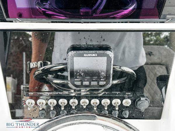 Slide: The Image of Control panel of a 2023 Sea Pro 239 DLX boat with Suzuki display. - 30