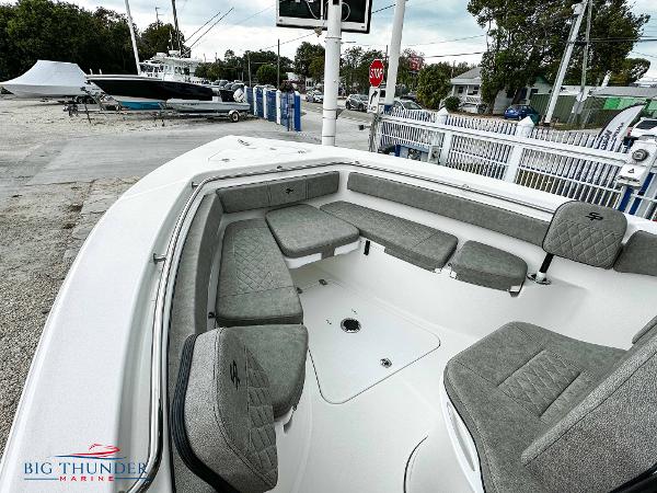 Slide: The Image of 2023 Sea Pro 239 DLX boat with spacious seating area at Big Thunder Marine. - 41