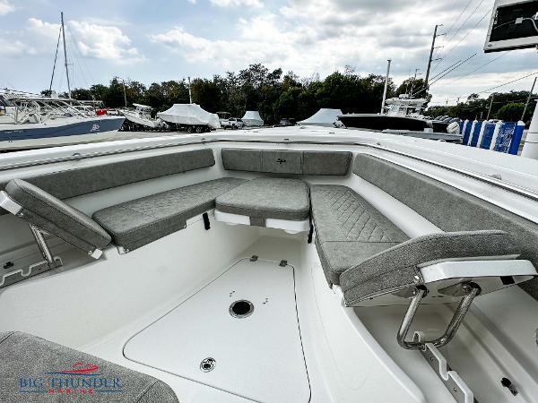 Slide: The Image of 2023 Sea Pro 239 DLX boat with spacious seating and modern design. - 42
