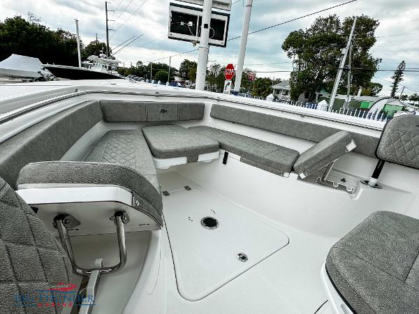 Slide: The Image of 2023 Sea Pro 239 DLX boat interior with gray cushioned seating. - 43