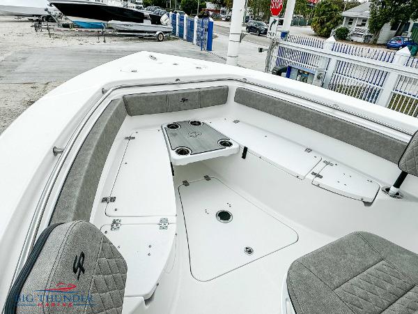 Slide: The Image of 2023 Sea Pro 239 DLX boat interior with seating and storage compartments. - 44