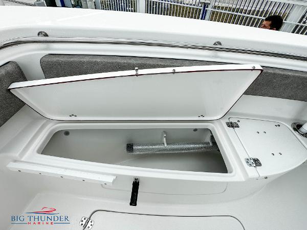 Slide: The Image of 2023 Sea Pro 239 DLX boat storage compartment open, Big Thunder Marine logo. - 47