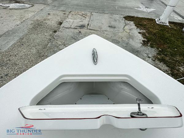 Slide: The Image of 2023 Sea Pro 239 DLX boat bow with anchor storage compartment. - 48