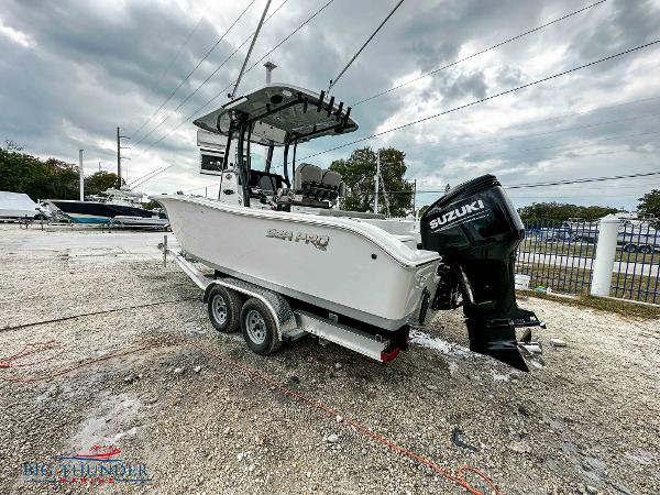 Slide: The Image of 2023 Sea Pro 239 DLX boat on trailer with Suzuki outboard motor. - 5