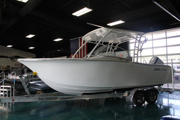 Slide: The Image of 2024 Sea Pro 240 boat on trailer in showroom. - 0
