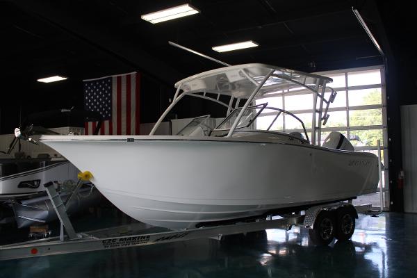 Slide: The Image of 2024 Sea Pro 240 boat on trailer in showroom. - 1