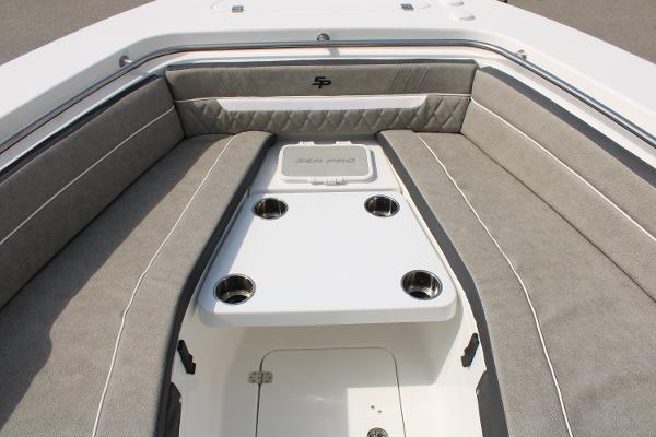 Slide: The Image of 2024 Sea Pro 240 boat interior with cushioned seating and cup holders. - 10