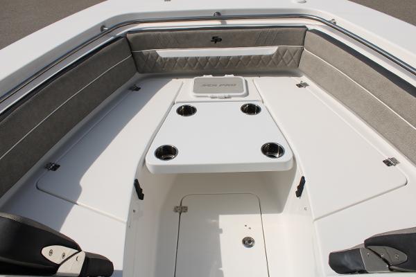Slide: The Image of 2024 Sea Pro 240 boat interior with cushioned seating and cup holders. - 11