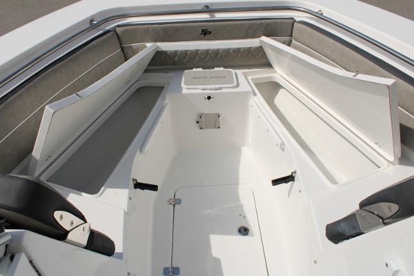 Slide: The Image of 2024 Sea Pro 240 boat interior with open storage compartments. - 12