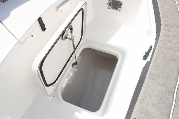 Slide: The Image of 2024 Sea Pro 240 boat storage compartment with open hatch. - 14