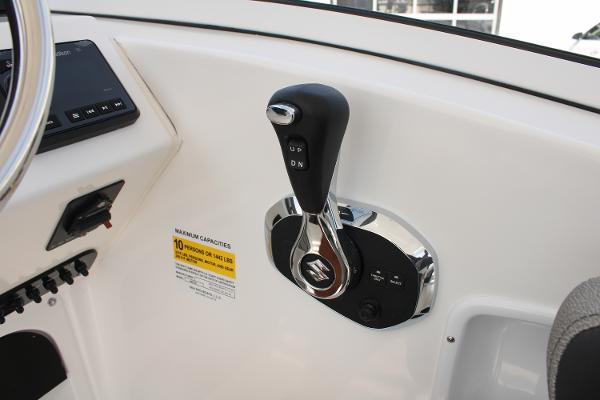 Slide: The Image of Close-up of the control lever on a 2024 Sea Pro 240 boat. - 16