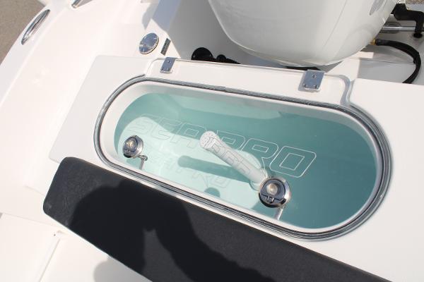 Slide: The Image of 2024 Sea Pro 240 boat livewell with clear lid and white interior. - 19