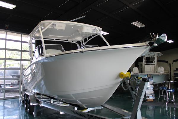 Slide: The Image of 2024 Sea Pro 240 boat on trailer in showroom. - 2