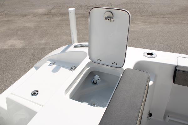 Slide: The Image of 2024 Sea Pro 240 boat with open storage compartment and seating. - 26